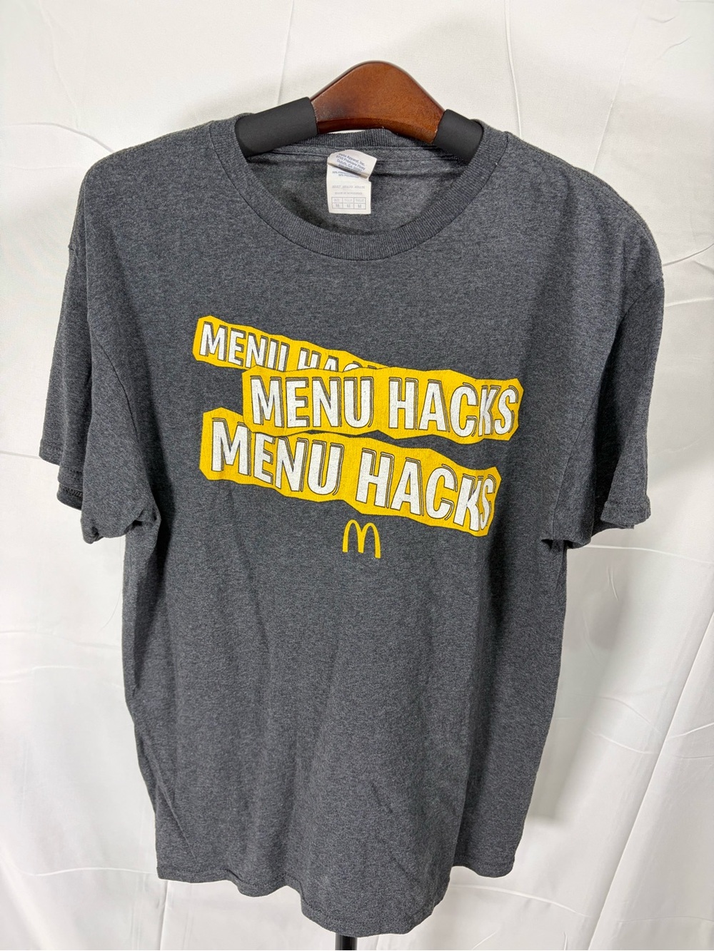Delta Men's Dark Charcoal Short Sleeve Tee with Yellow 'Menu Hacks' Graphic